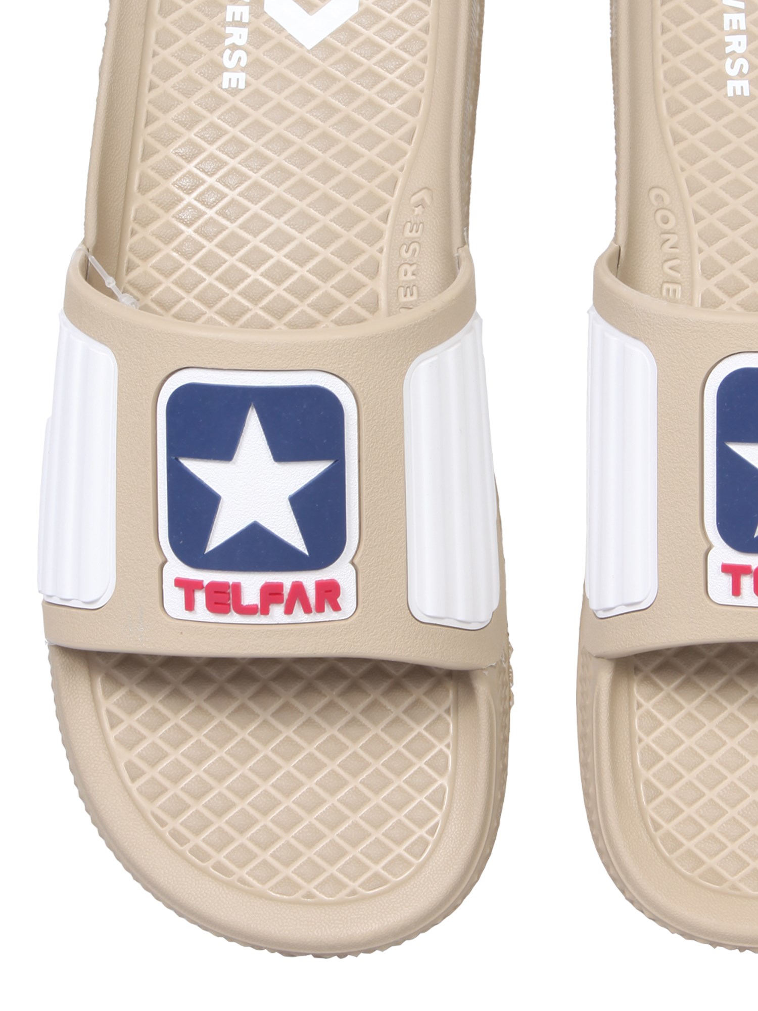 Telfar Converse rubber slide sandals with logo.